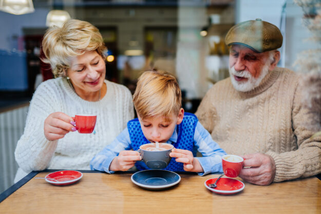 Older parents and child in cafe